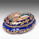 A Bleu Royal ground Sevres porcelain box decorated with a beauty in a garden setting, H 12 - W 28 cm