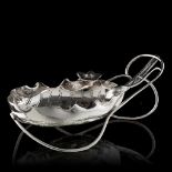 A silver-plated Japanese inspired leaf-shaped sugar basket, marked John Grinsell & Sons, Birmingham,
