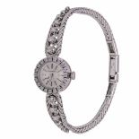 A 18ct white gold ladies' Jaeger-LeCoultre wristwatch set with brilliant cut diamonds, L 18,2 cm, we