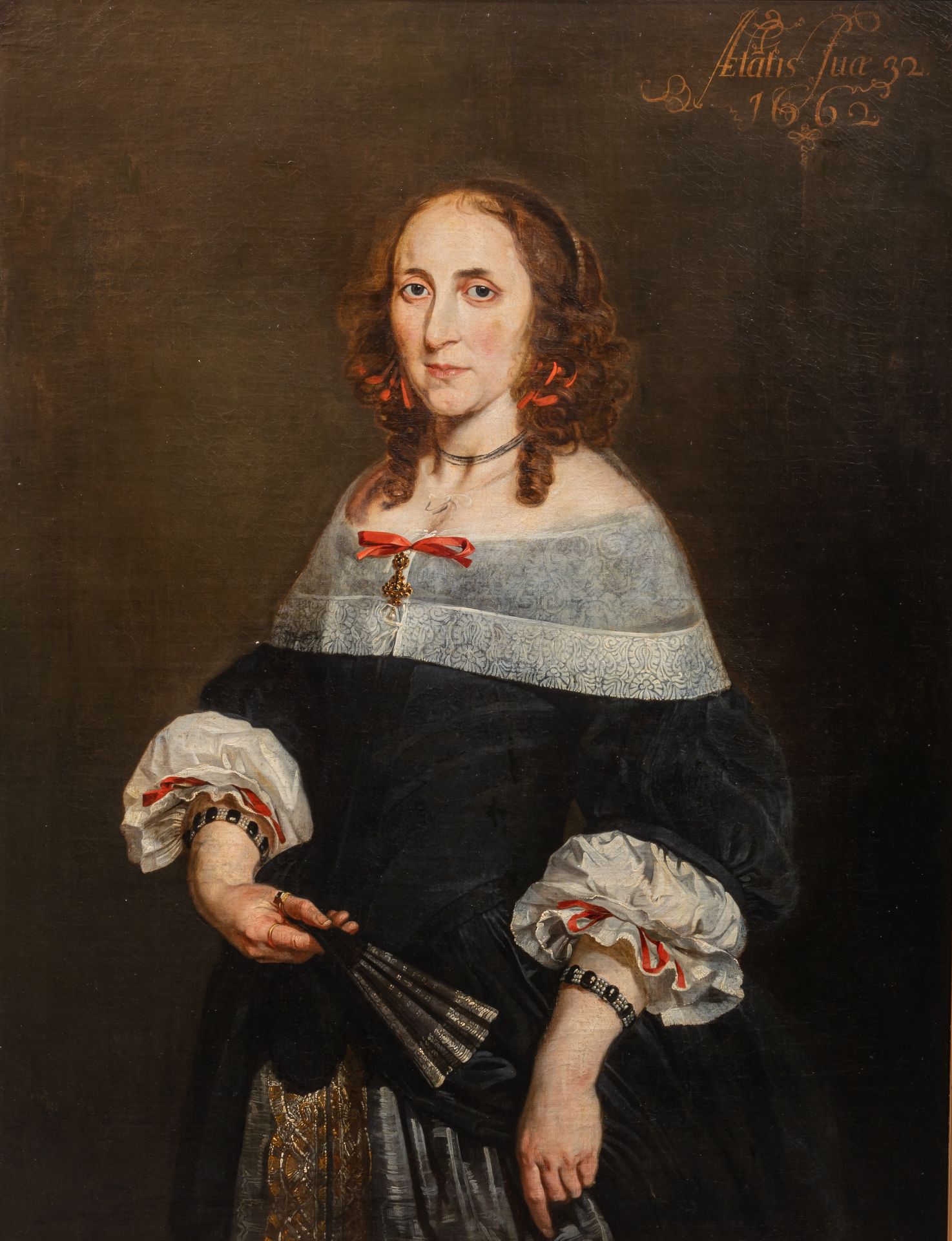 The half-length portrait of an elegant lady, age 32, holding a fan, 1662, Dutch School, oil on canva
