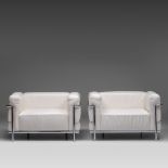 A pair of LC3 white leather 1seater, by Le Corbusier, Pierre Jeanneret & Charlotte Perriand for Cass