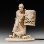 A Japanese ivory okimono of a man with chickens and chicks, Meiji period, H 12,2 cm, 252 g (+)