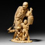 A Japanese ivory okimono of a farmer and his son, black stained, Meiji period, H 24 cm - 883 g (+)