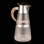 A cut glass carafe with silver-plated mounts and a wooden horn-shaped handle, marked Hukin & Heath,