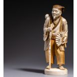 A Japanese ivory okimono of a jolly grandfather, Meiji period, 21,1 cm, 672 g (+)