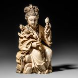 A Chinese mammoth ivory figure of a Guanyin on a wooden base, Qing dynasty, H 24 cm