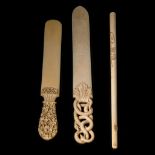 Two paper knives 27,6 - 31,7 cm / 50 - 66 g; and a Japanese Meiji / Taisho cigarette holder L 30,6 -