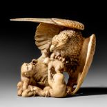 A Japanese Meiji period ivory okimono of an eagle attacking monkeys, H 8,7 cm - 179 g (+)