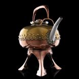 A Japanese inspired yellow and red copper tea kettle and stand, with a silver-plated mount and rivet
