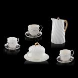 A matching collection of a porcelain egoiste, a sugar bowl and three cups, H 5 - 12,5 cm