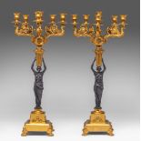 A pair of Empire style gilt and patinated bronze caryatid candelabras, H 55,5 cm