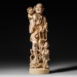 A Japanese Meiji period ivory okimono showing a jolly fisherman, H 43 cm - 3700 g (+)