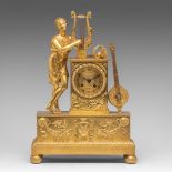 A Charles X gilt bronze mantle clock decorated with an allegory of music, H 43,5 cm
