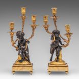 A pair of Neoclassical gilt and patinated bronze figural candelabras, after a model of Clodion, H 45