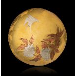 A yellow copper platter inlaid with flowering foliage, with a scalloped gallery, marked Benham & Fro