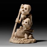 A skeleton holding a skull riding a toad, Meiji period, H 5,6 cm - 33 g (+)