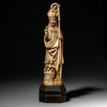 A mammoth ivory sculpture of St. Nicolas, Paris, first quarter of the 20thC, H 53,5 cm (base incl.)