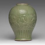 A Chinese carved Longquan celadon 'Peony' jar, Ming dynasty, H 32,5 cm