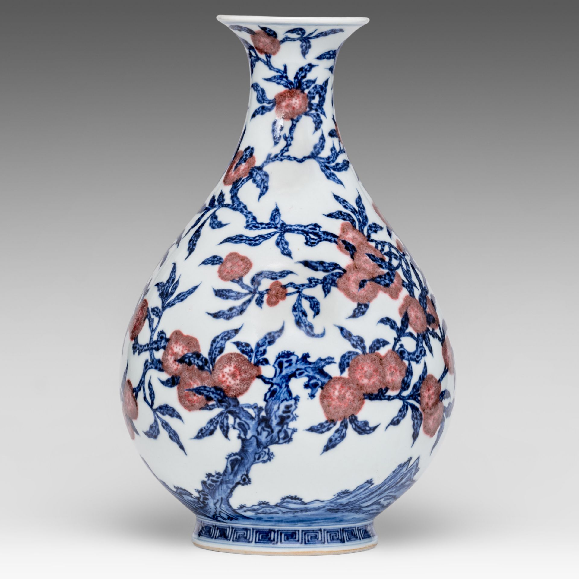 A Chinese blue and white and copper red 'Peaches' yuhuchunping vase, with a Yongzheng mark, H 32,5 c