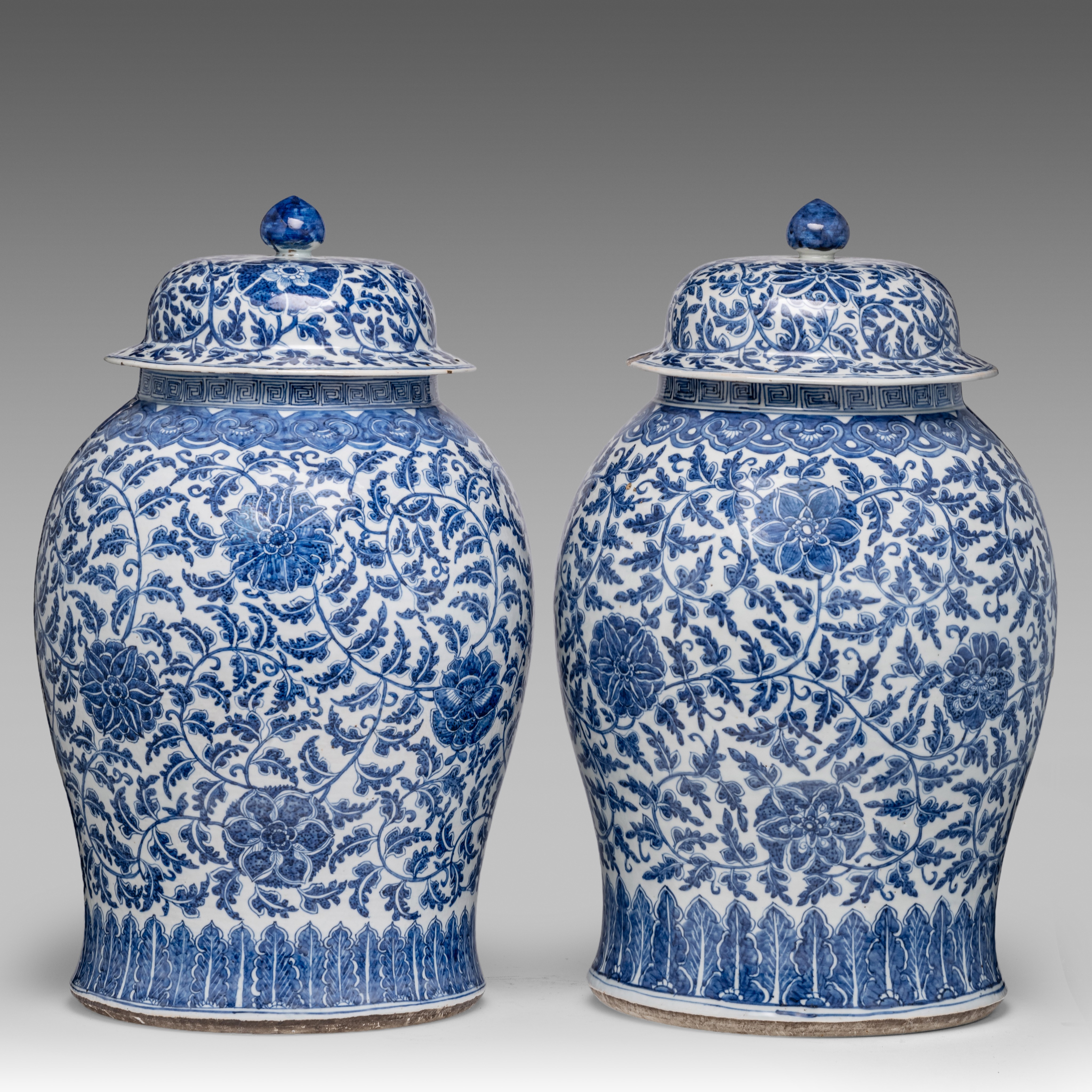 A pair of Chinese blue and white 'Scrolling Lotus' baluster vases and covers, 19thC, H 61,5 cm - Image 3 of 8