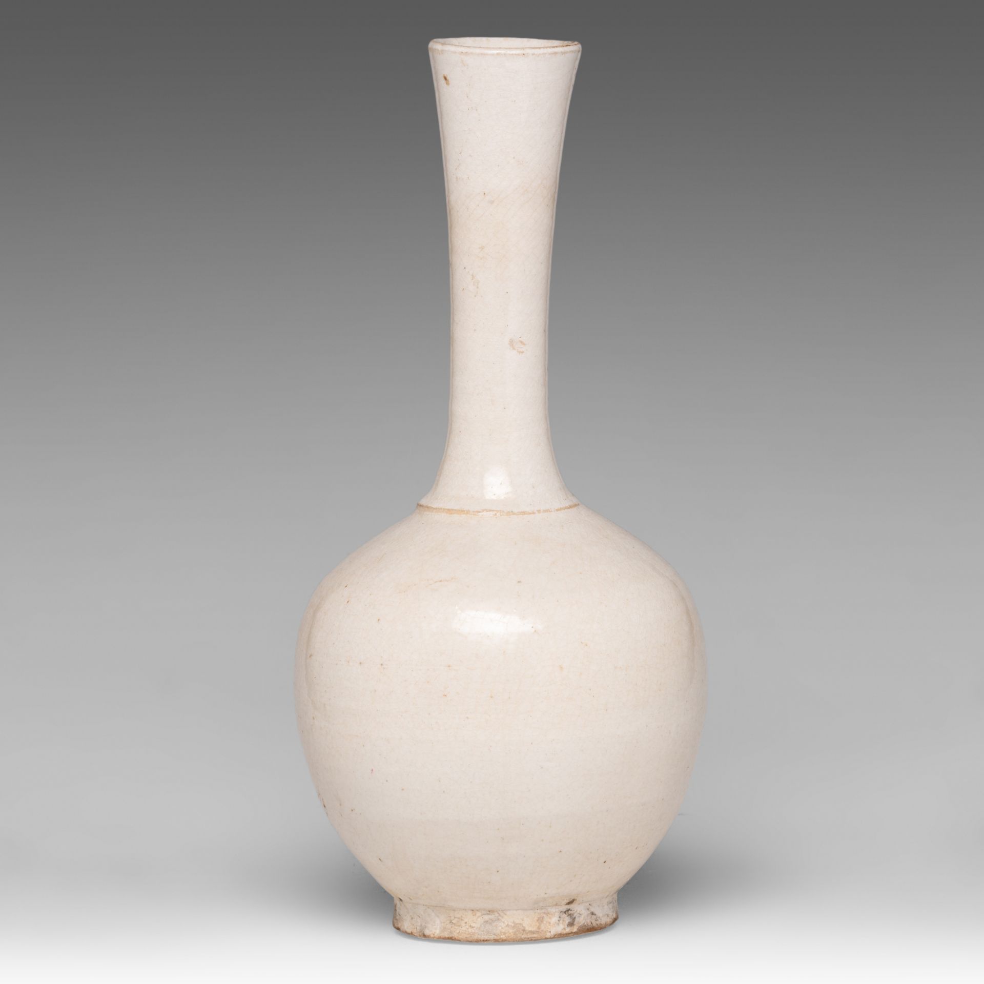 A Chinese cream-glazed bottle vase, Song-Ming dynasty, H 31 cm - Image 2 of 6