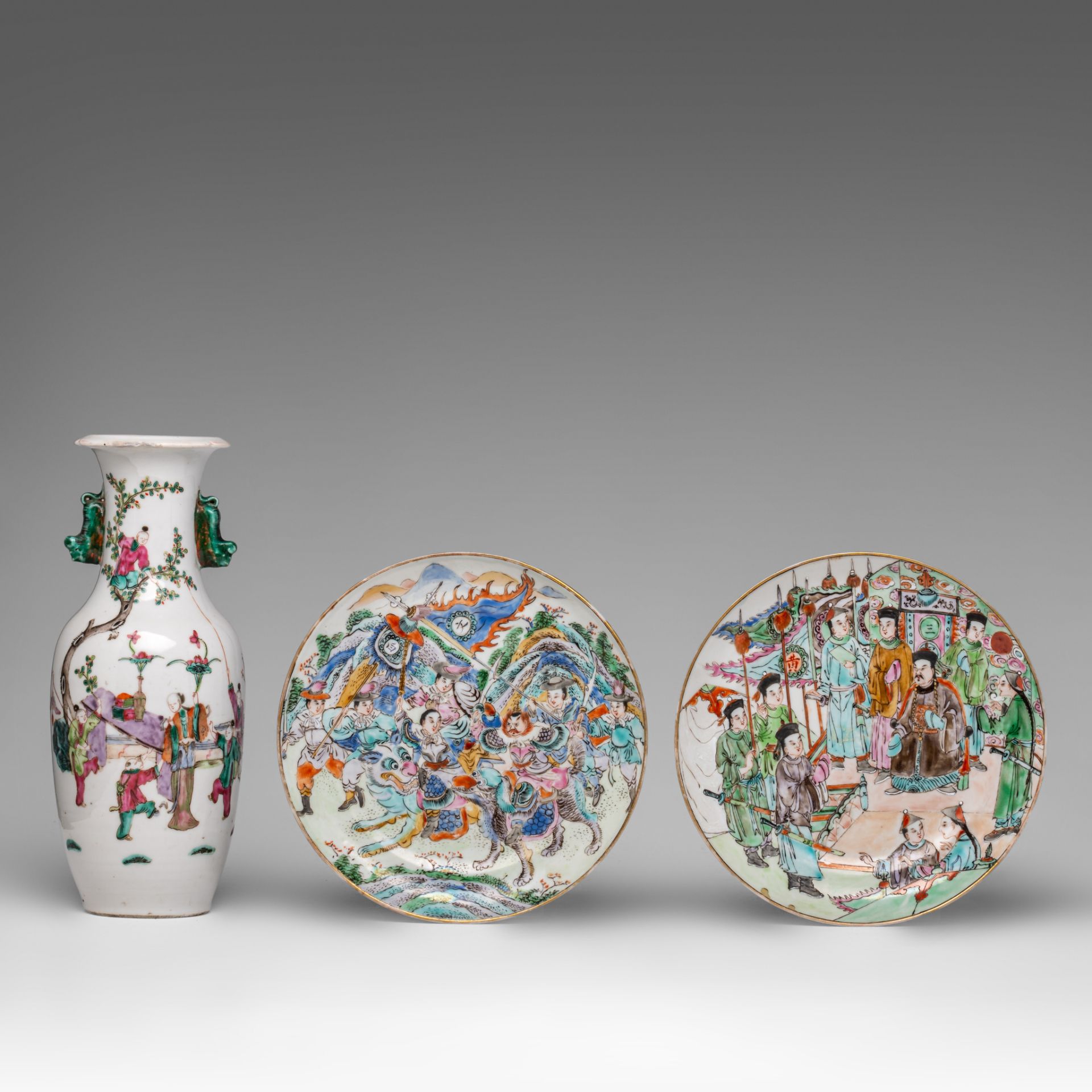 Two rare Chinese famille rose 'Battle scene' Canton dishes, 19thC, dia 19,5 cm - and a famille rose