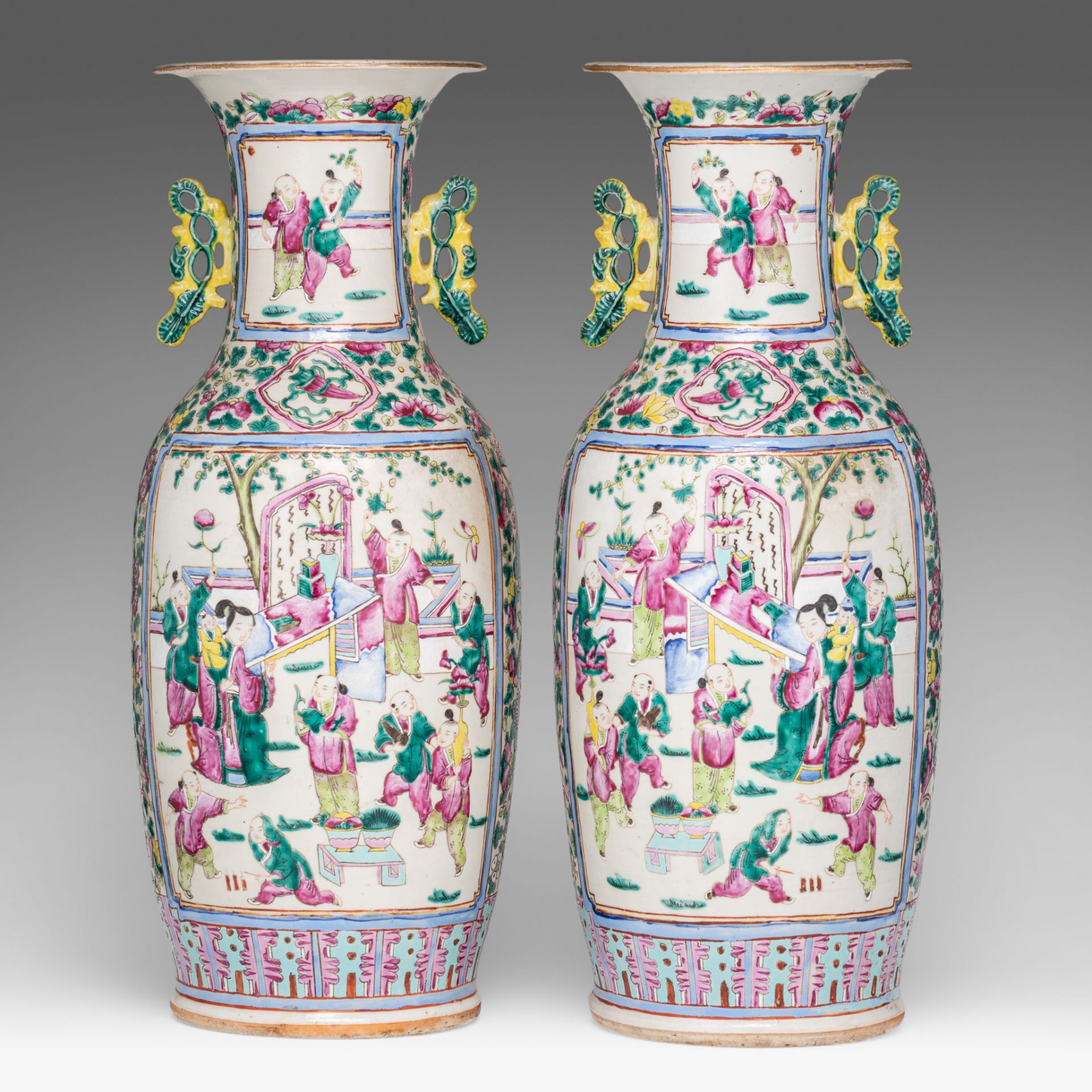 A pair of Chinese famille rose 'Playful boys in a garden' vases, paired with lingzhi handles, 19thC,