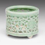 A Chinese celadon glazed reticulated 'Flower' tripod censer, H 6,2 cm