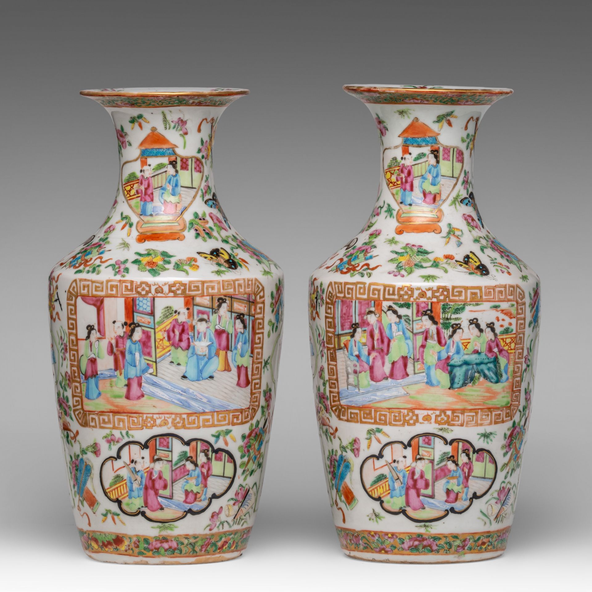 A similar pair of Chinese Canton famille rose on white ground vases, 19thC, H 34,8 cm