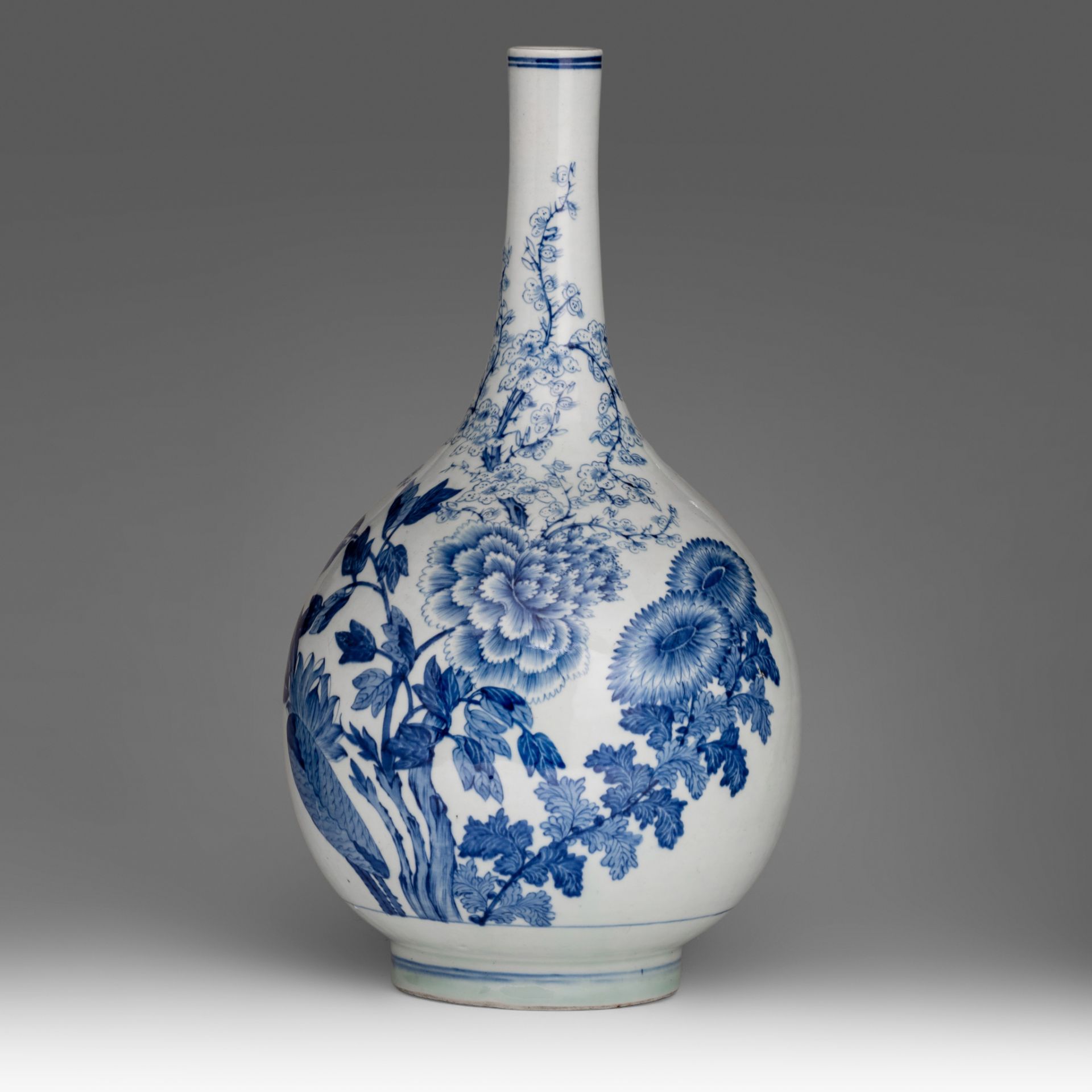 A large and elegant Chinese blue and white 'Flower Garden' bottle vase, late Qing, H 47,5 cm