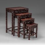 A set of four Chinese carved hardwood nesting tables, tallest H 68,5 cm