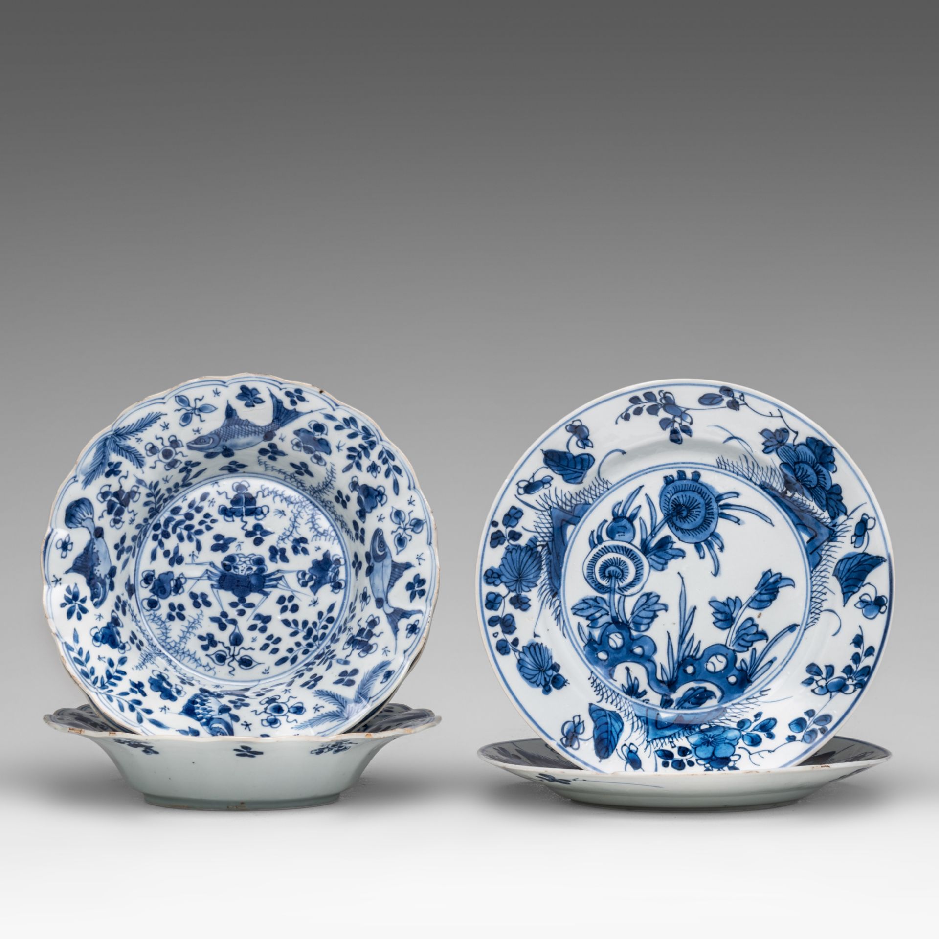 A series of three Chinese blue and white 'Crab and fish' deep dishes, Kangxi period, dia 20 cm - add