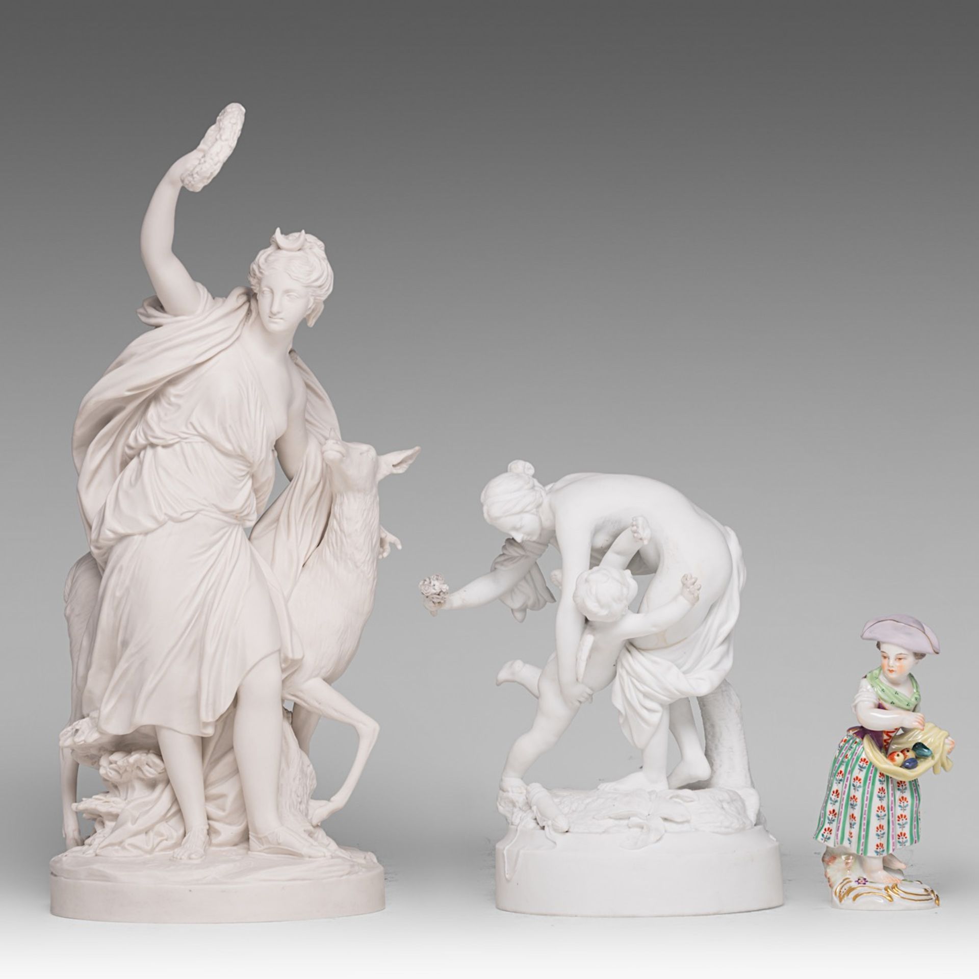 A collection of two biscuit groups and a Meissen polychrome porcelain figurine, H 13,5 - 37,5 cm