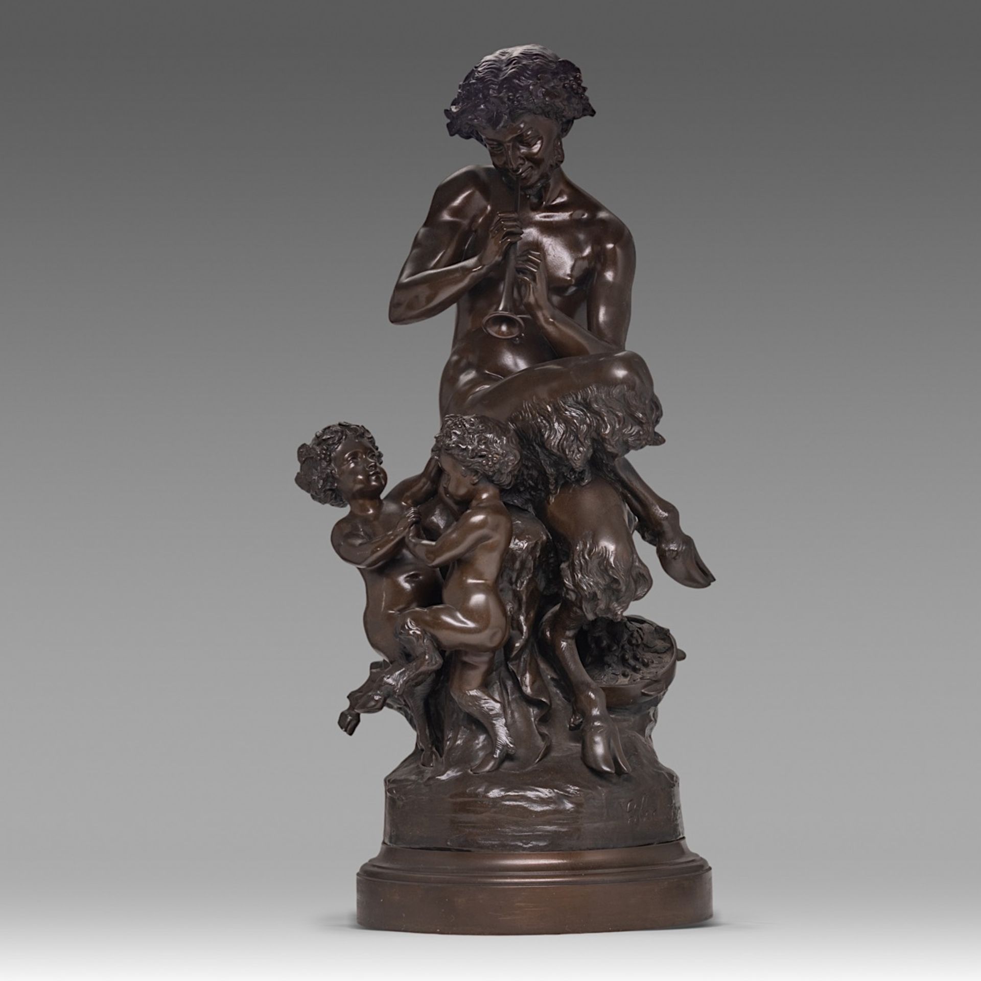 Clodion (1738-1814), Pan playing the flute surrounded by two putti, patined bronze, H 87 cm