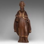 An oak sculpture of a bishop making his blessing, with gilt details, 17thC, H 69 cm