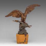 A patinated bronze table lamp with Zeus represented as an eagle, presented on a yellow Sienna marble