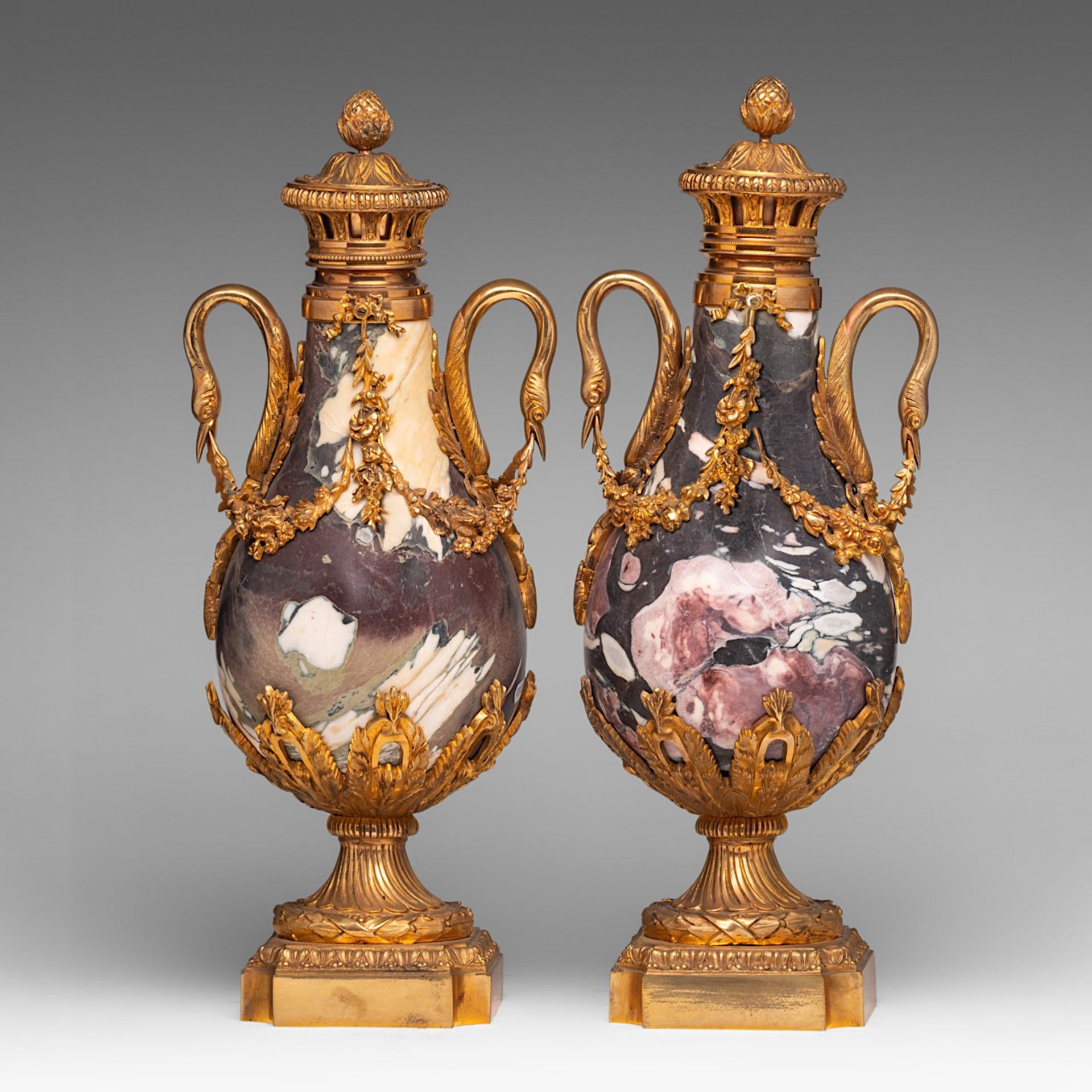 A pair of Neoclassical marble cassolettes with gilt bronze mounts, H 55 cm