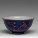 A Chinese gilt on blue ground 'Dragon' bowl, with a Qianlong mark and of the period, H 7 - dia 14,2