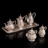 A five-part Russian silver coffee and tea set on a matching plate, 84 Zolotniki, H 15 - 20 cm
