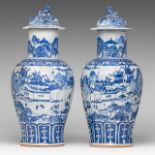 A pair of Chinese blue and white 'Townscape' baluster vases and covers, Qianlong/Jiaqing period, Tot