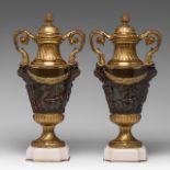 A pair of Neoclassical gilt and patinated bronze cassolettes, decorated with putti, H 48,5 cm