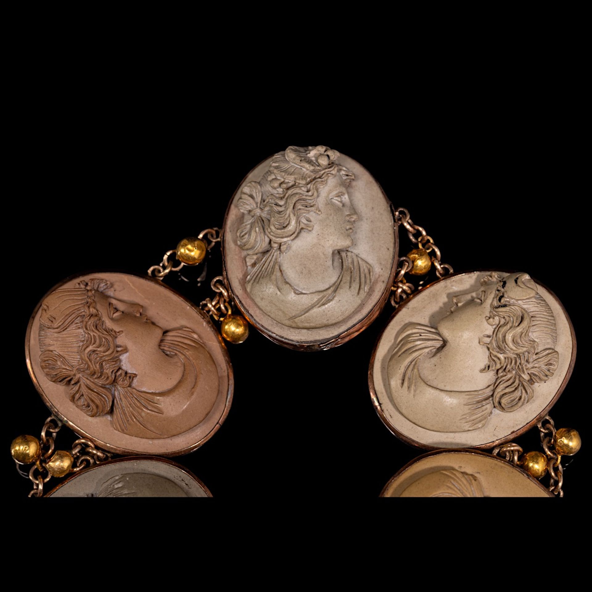 A Victorian lava cameo bracelet in gilt metal mount, L 18,5 cm, and two oval cornelian shell cameos, - Image 3 of 4
