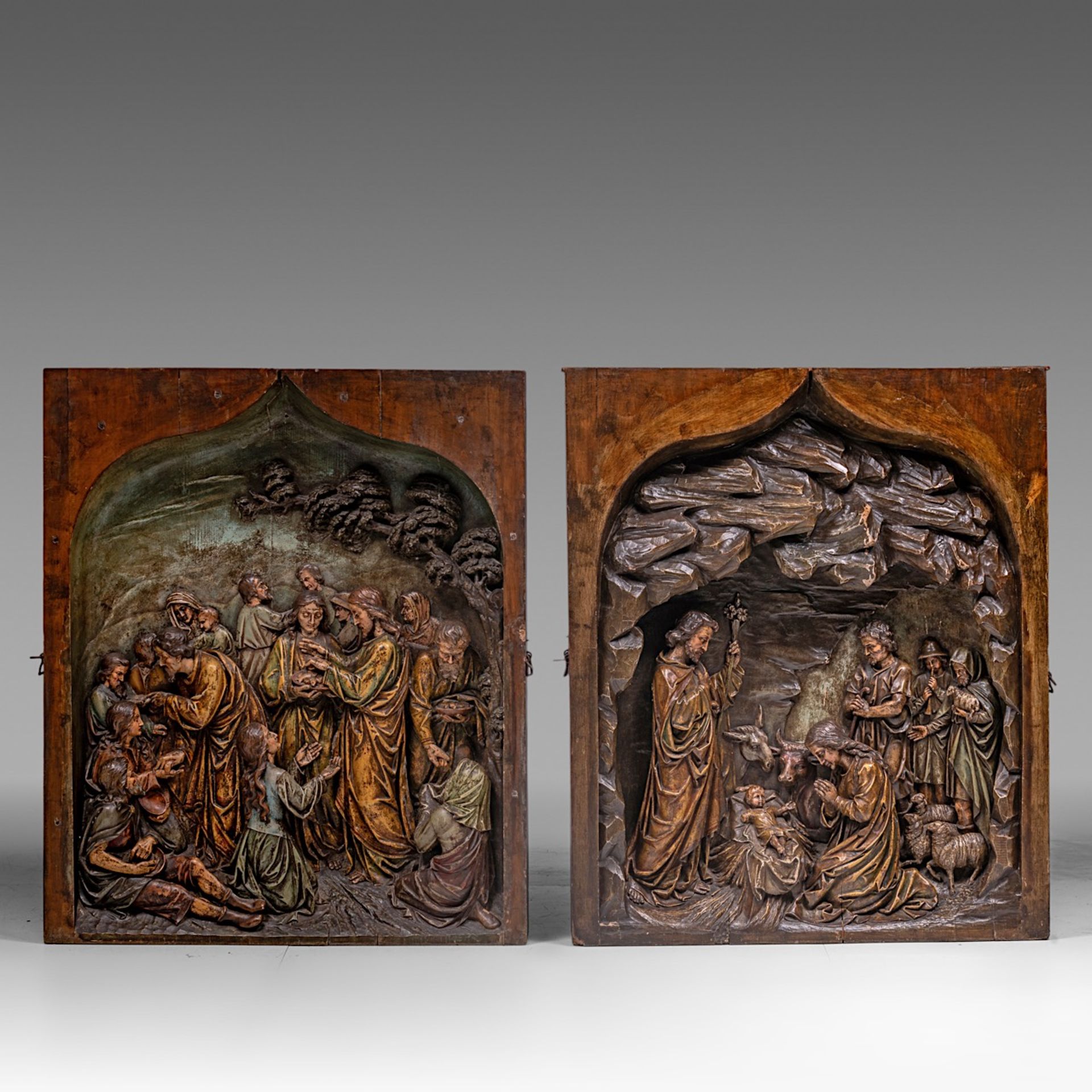 A pair of Gothic Revival alto-relievo carved retables fragments, with tracs of polychrome paint, H 1