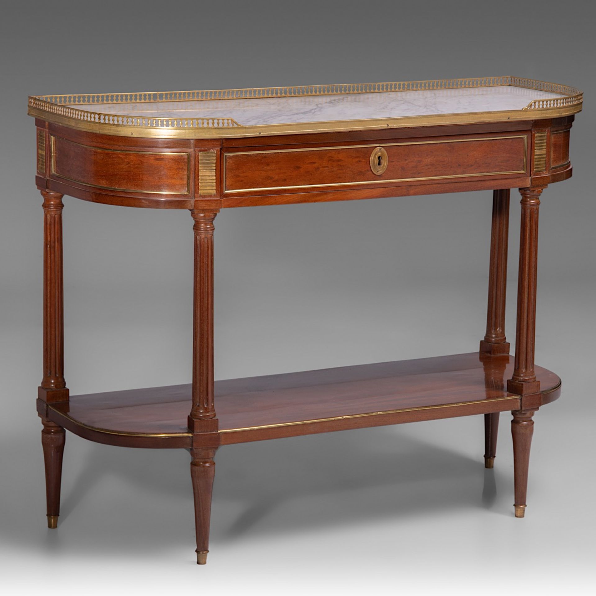 A fine Louis XVI mahogany veneered 'console desserte', with gilt bronze mounts and Carrara marble to