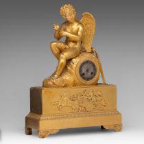 A Charles X gilt bronze mantle clock with Cupid on top, H 51 cm