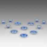 Six matching sets of Chinese blue and white floral decorated tea cups and saucers, Kangxi period, di