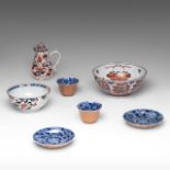 Two sets of Chinese blue and white and cafe-au-lait tea cups and saucers, marked Kangxi and of the p