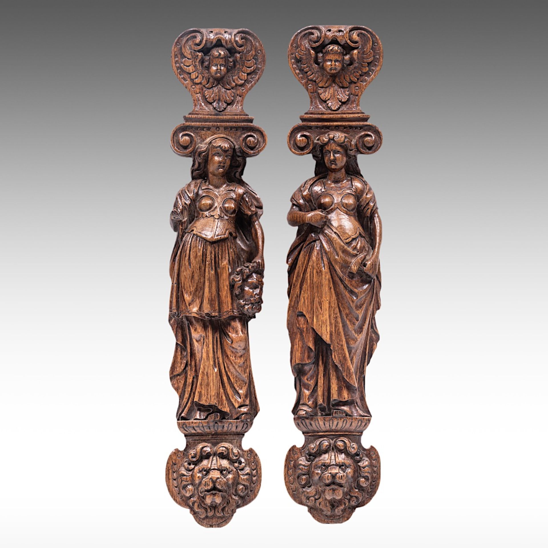 A pair of carved oak architectural ornaments of caryatids, 17thC, H 66 cm