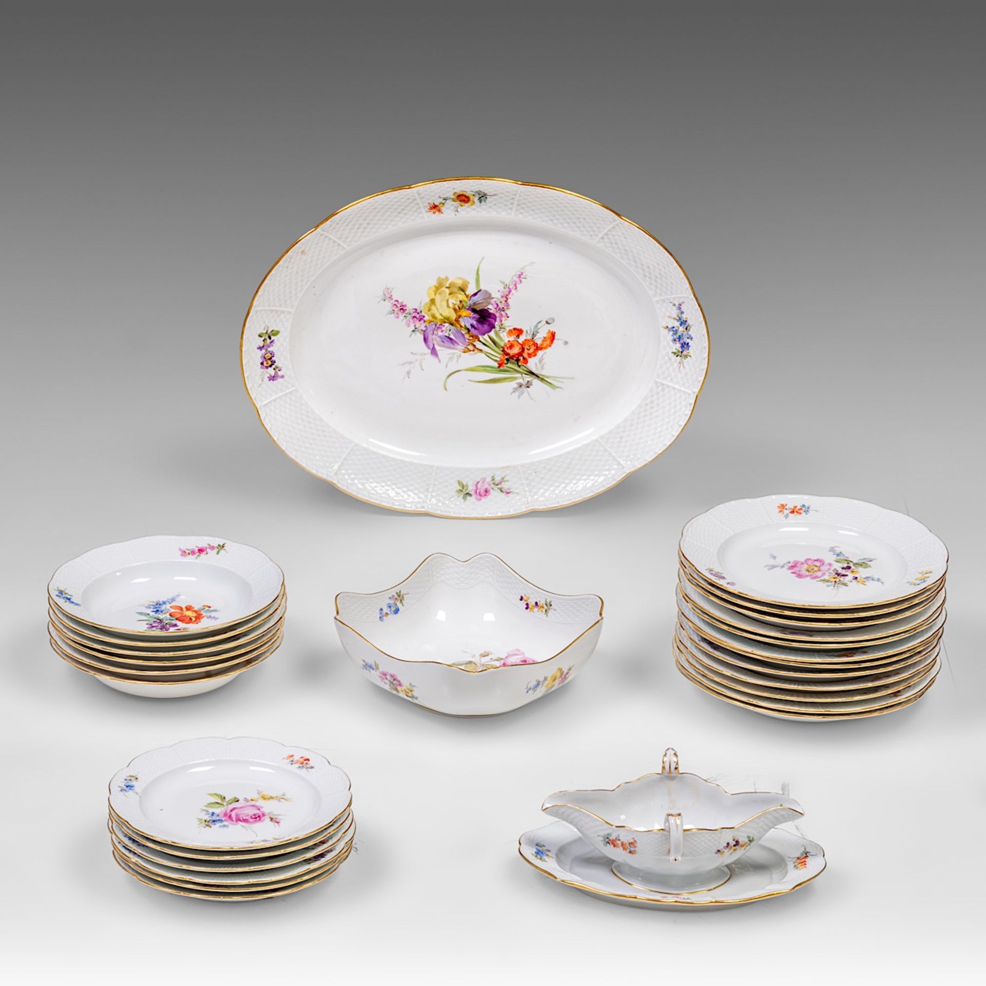 A Meissen porcelain service set with 'Alte Ozier' edges and hand-painted floral decoration, marked (