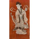 A Chinese silk embroidery depicting a female Immortal, late Qing, framed 68 x 128,5 cm